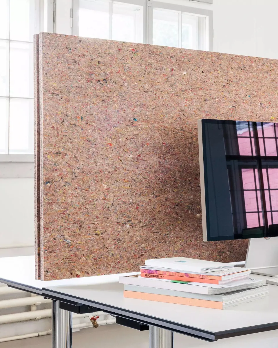 Création Baumann absorber made from recycled textile offcuts as a desk screen.