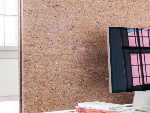 Création Baumann absorber made from recycled textile offcuts as a desk screen.